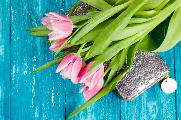 Beautiful pink tulips on blue wood background — Stock Photo, Image