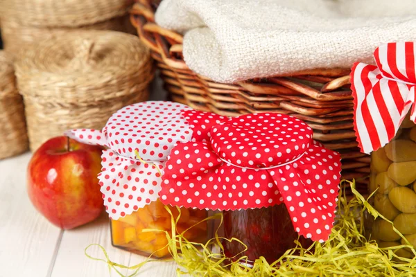 Preserves on white wood background — Stock Photo, Image