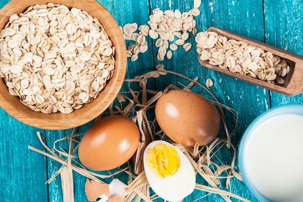 Organic eggs on blue wood background — Stock Photo, Image