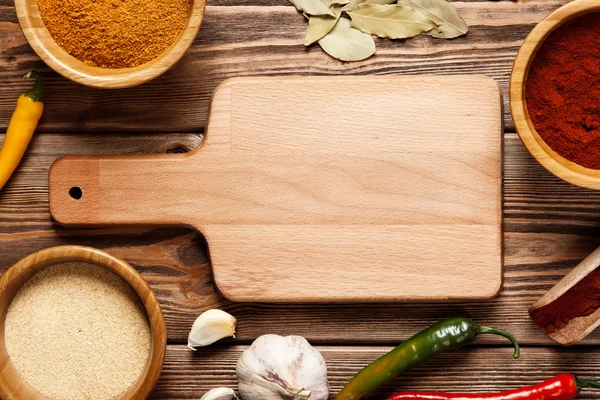 Surtido de especias en una mesa de madera — Foto de Stock