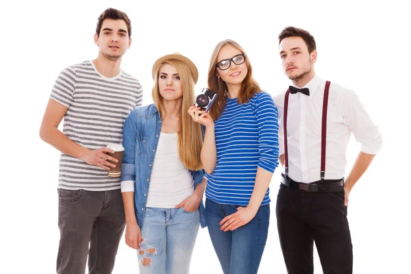 Quatro jovens elegantes em fundo branco — Fotografia de Stock