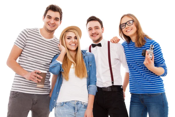 Vier stylische junge Leute auf weißem Hintergrund — Stockfoto