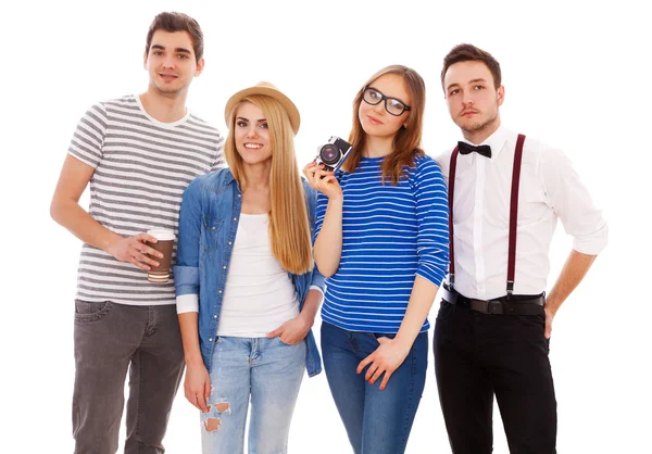 Quatro jovens elegantes em fundo branco — Fotografia de Stock