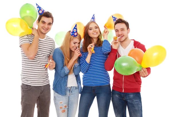 Group of young people having a birthday party Royalty Free Stock Images