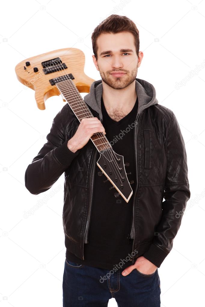 Handsome young man with an electric guitar