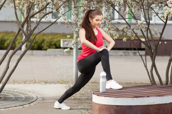 Young beautiful woman running in the city — Stock Photo, Image