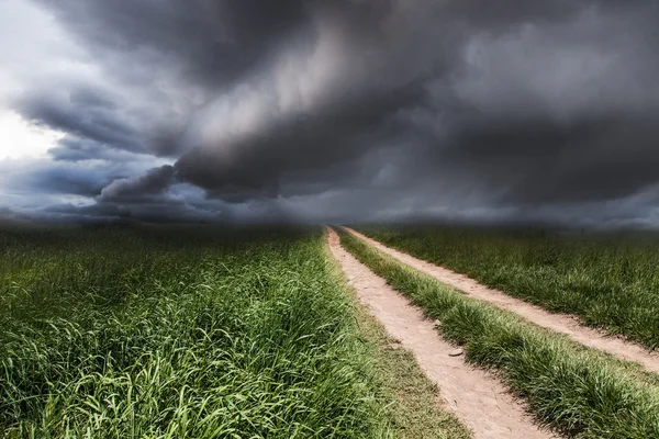 Dramatic landscape with a rural road — Stock Photo, Image