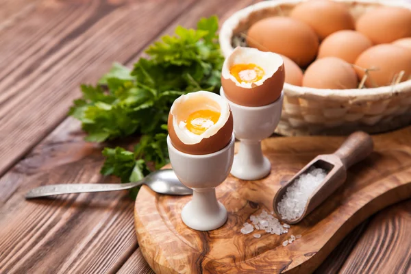 Boiled eggs on a wooden background — Stock Photo, Image