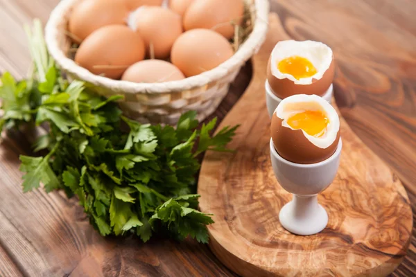 Boiled eggs on a wooden background — Stock Photo, Image