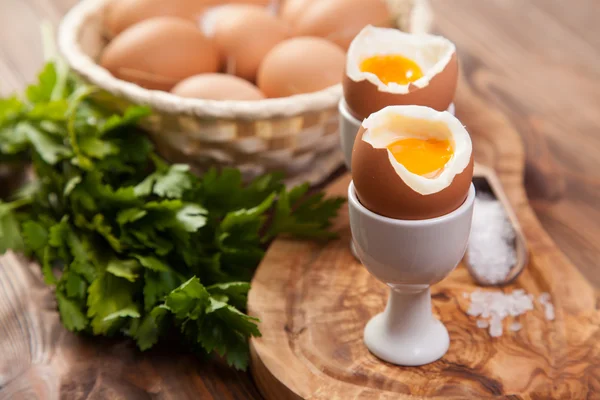 Boiled eggs on a wooden background — Stock Photo, Image