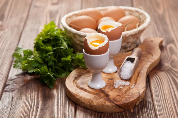 Boiled eggs on a wooden background — Stock Photo, Image