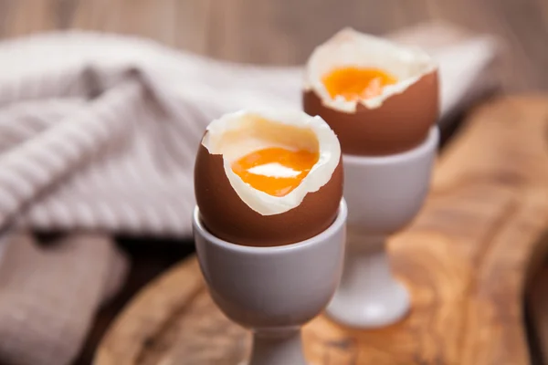 Boiled eggs on a wooden background — Stock Photo, Image