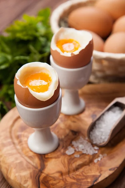 Boiled eggs on a wooden background — Stock Photo, Image