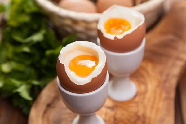 Boiled eggs on a wooden background — Stock Photo, Image