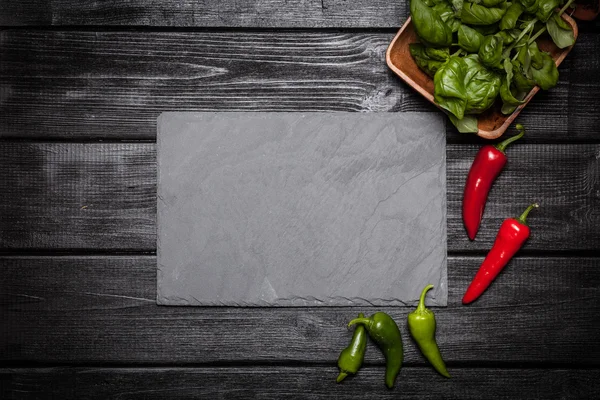 Stone board with different spices — Stock Photo, Image