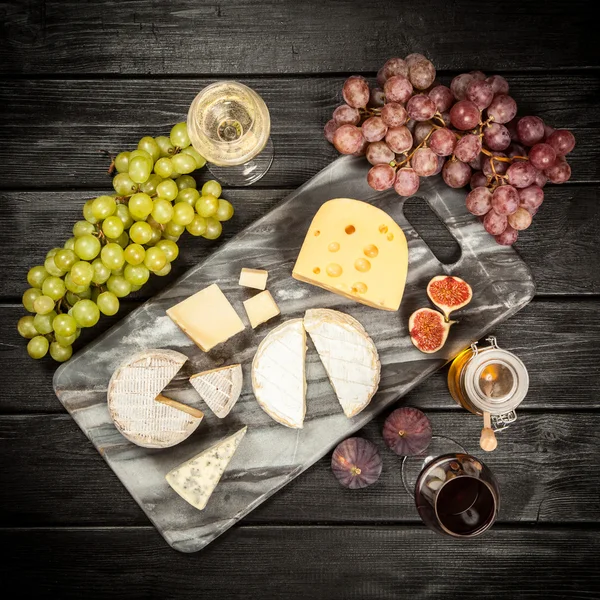 Wine and cheese — Stock Photo © gdolgikh 5728945