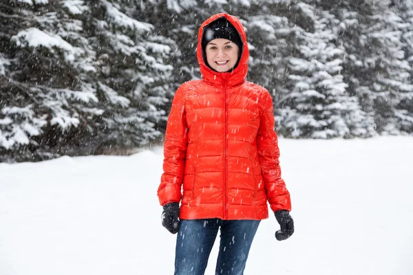 Pretty young woman playing snowballs — Stock Photo, Image
