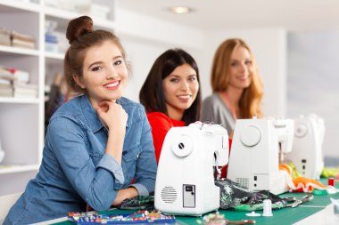 Women in a sewing workshop clipart