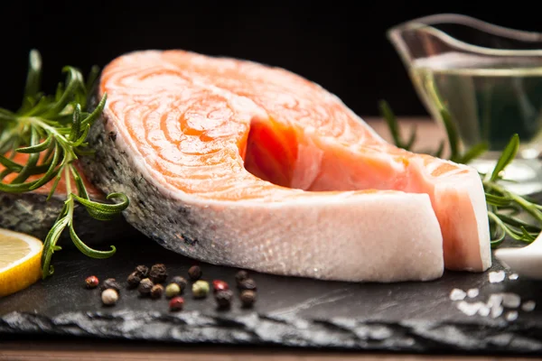 Fresh salmon on old wood — Stock Photo, Image