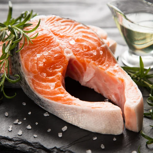 Fresh salmon on old wood — Stock Photo, Image