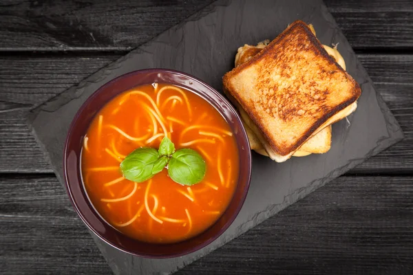 Tomato soup and basil — Stock Photo, Image