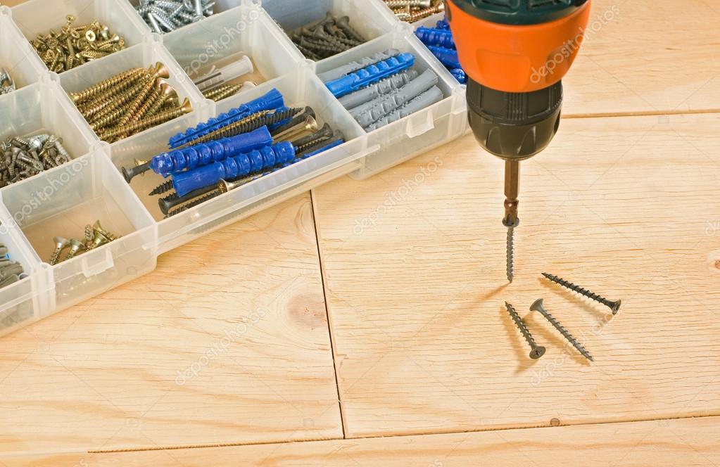 Cordless drill, screws and toolbox Stock Photo by ©pgkirich 101624914