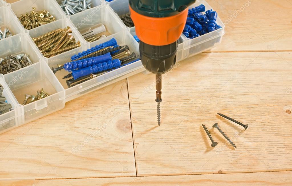 Cordless drill, screws and toolbox Stock Photo by ©pgkirich 102608060