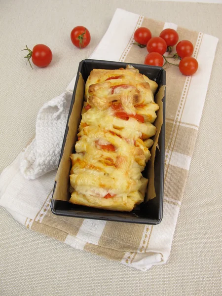 Pull-Apart-Bread with tomatoes and cheese in loaf pan
