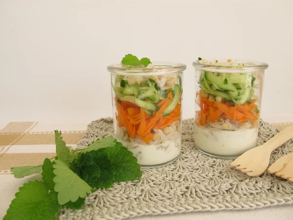 Salad to go in jar with rice, barley, carrot and cucumber — Stock Photo, Image