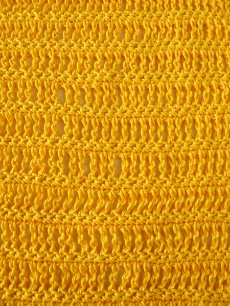 Crochet pattern from single and triple crochet stitch in yellow — Stock Photo, Image