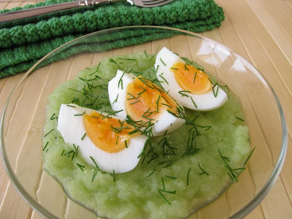 Eggs on cucumber puree with dill — Stock Photo, Image