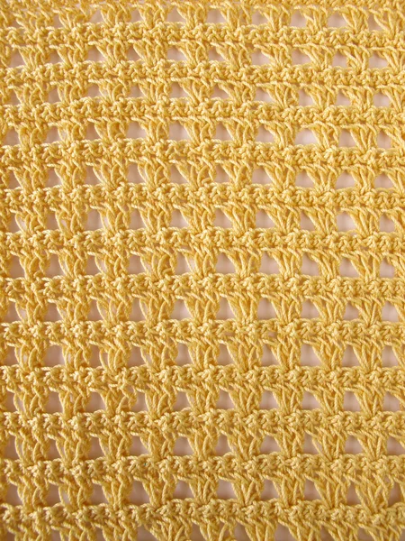 Crochet pattern background in yellow — Stock Photo, Image