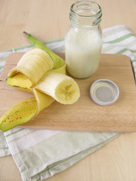 Bottle of kefir with banana — Stock Photo, Image