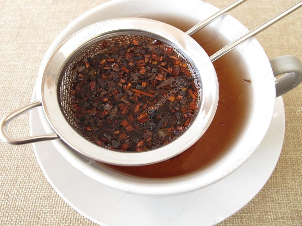 Honey bush tea in tea strainer