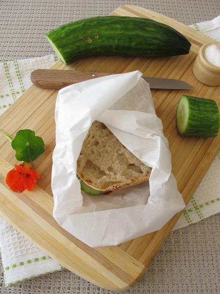 Cucumber sandwich in greaseproof paper — Stock Photo, Image