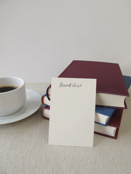 Books, blank booklist and cup of coffee — Stock Photo, Image