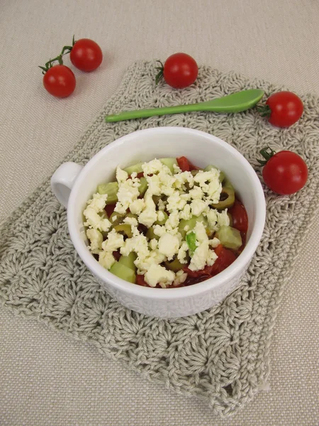 Crumble mug cake with tomatoes, cucumber, olives and feta crumbles from microwave — Stock Photo, Image