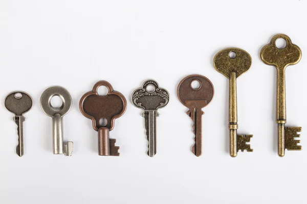 Row of old fashioned keys — Stock Photo, Image