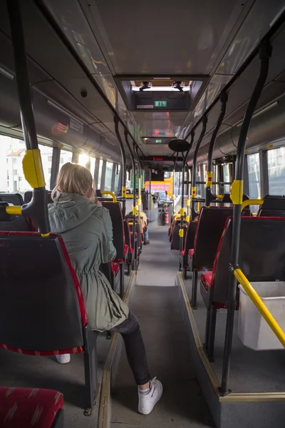 Teenage girl riding the bus