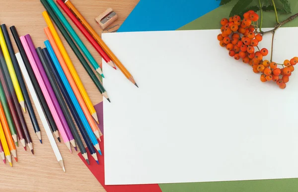 Pencils and paper on the table — Stock Photo, Image
