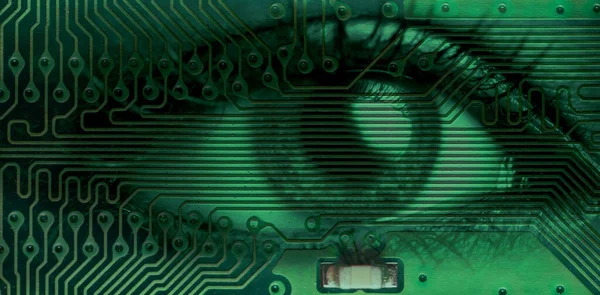 human eye and electronic board close up