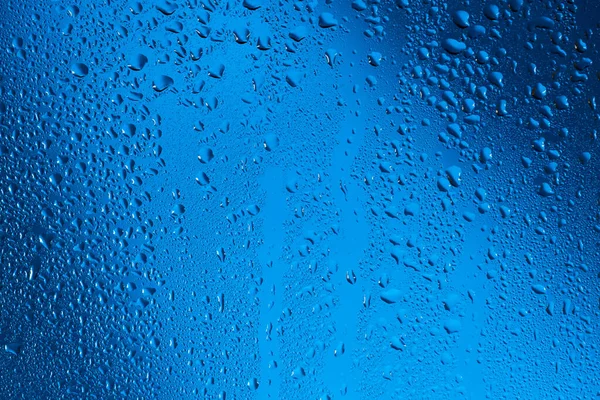 Gotas Agua Sobre Vidrio Sobre Fondo Azul — Foto de Stock