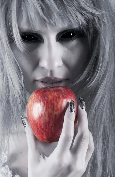 Witch holding an apple — Stock Photo, Image