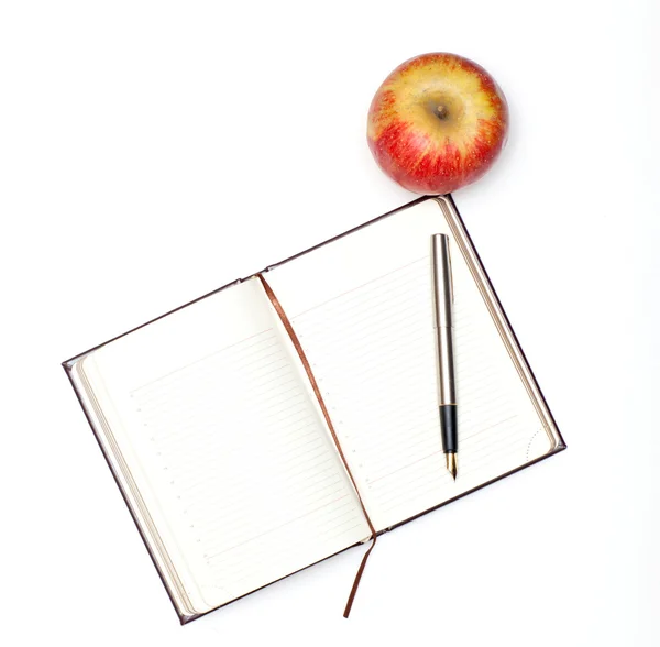 Notatnik i jabłko — Zdjęcie stockowe