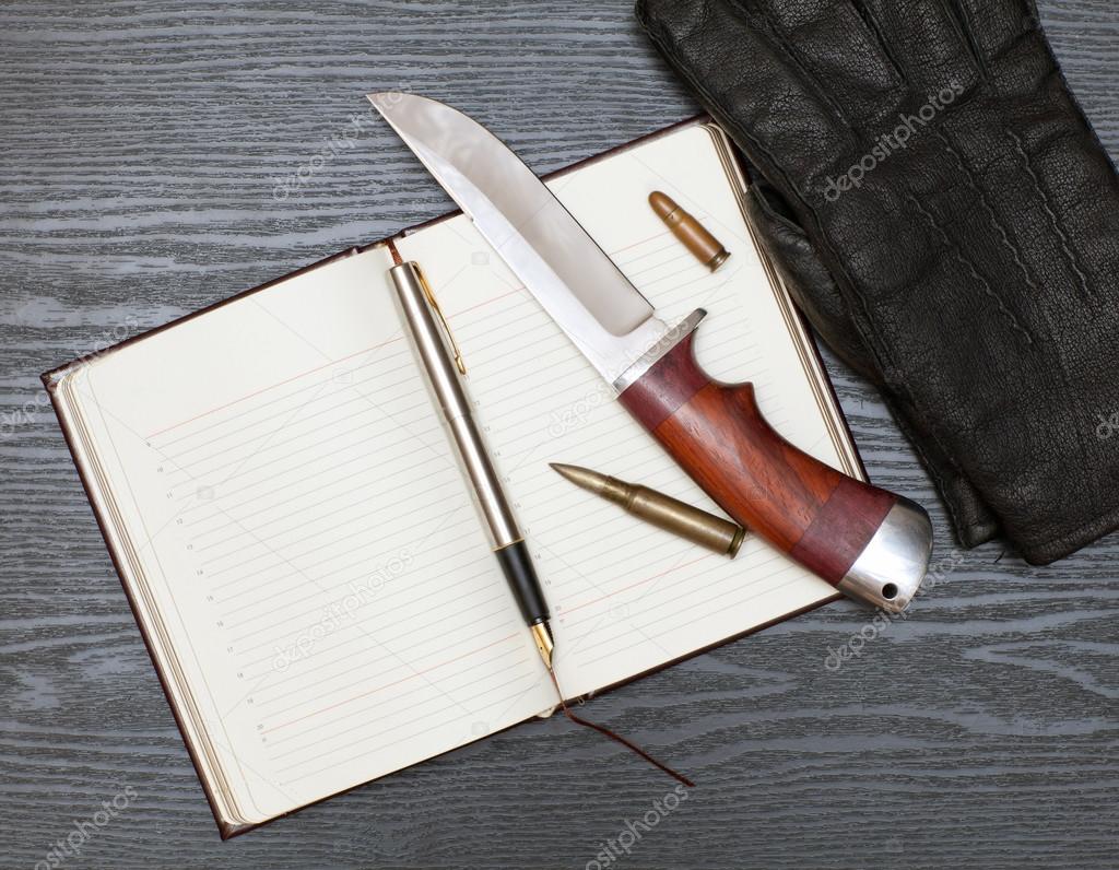 Knife and notebook
