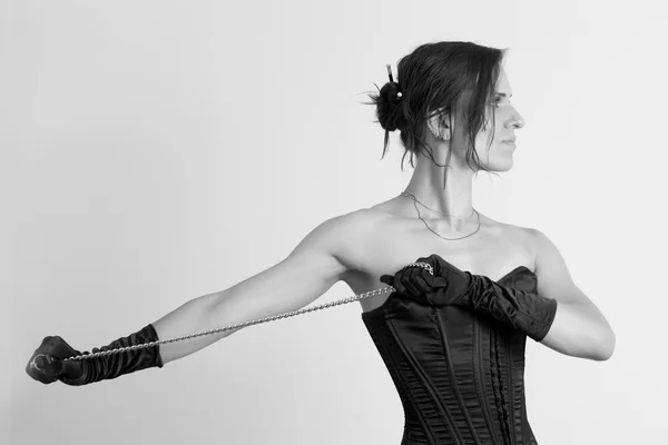 Woman in a corset and  chain — Stock Photo, Image