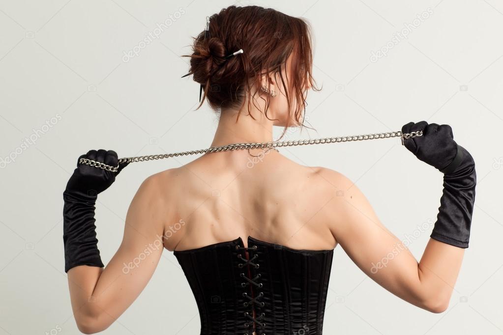 Woman in a corset and  chain