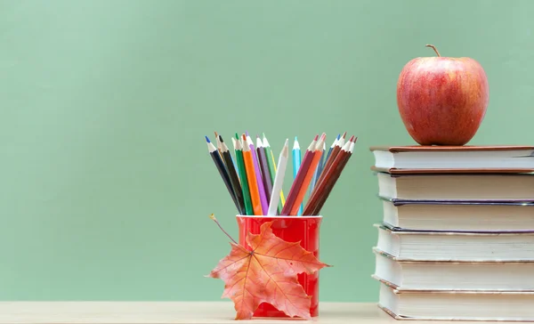 Colored pencils and books Stock Picture