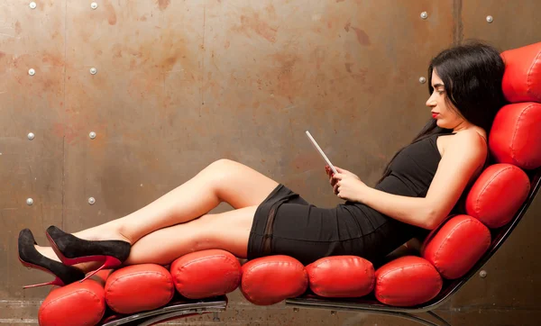 Woman in an armchair — Stock Photo, Image