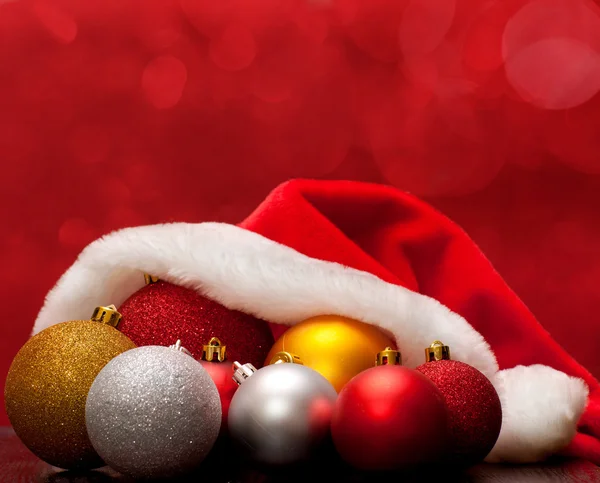 Cap and Christmas balls — Stock Photo, Image